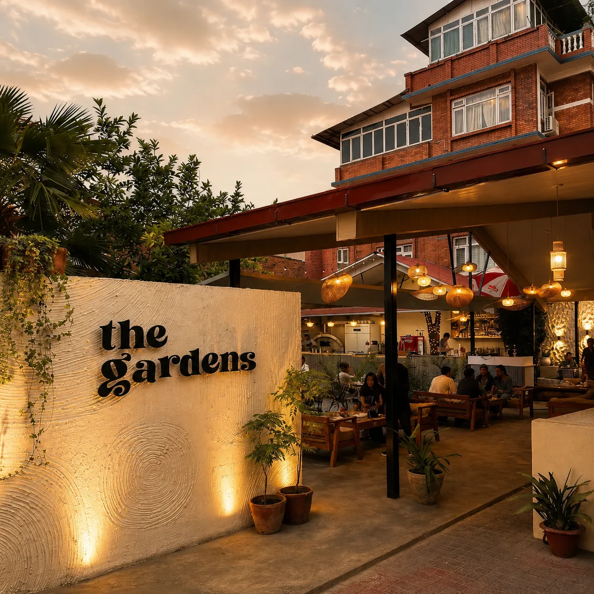 The Gardens Jhamsikhel restaurant entrance and outdoor seating at sunset