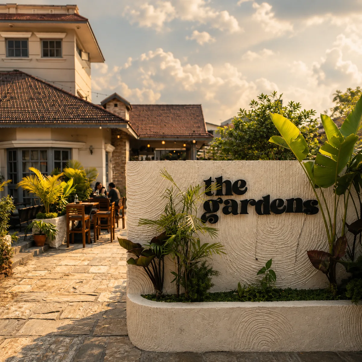 The Gardens Panipokhari entrance, terrace and garden in warm evening light